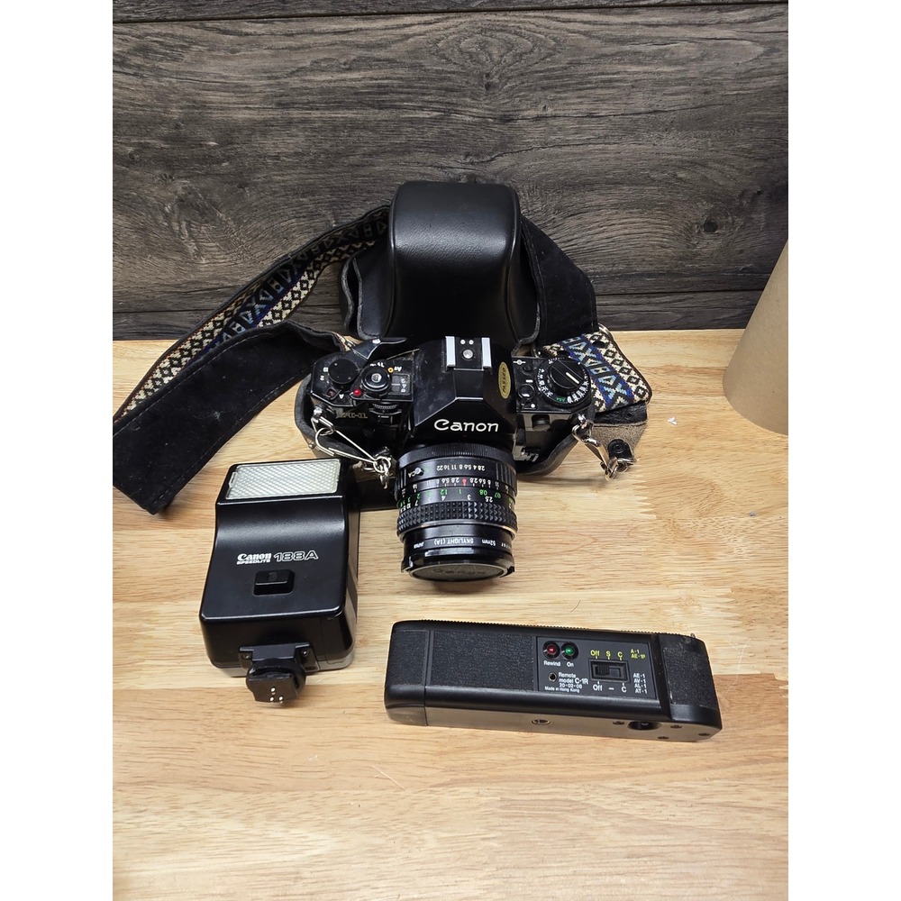 Canon A-1 35mm Film SLR Camera 28mm f2.8 Lens Speedlite 188A Flash Remote Bundle